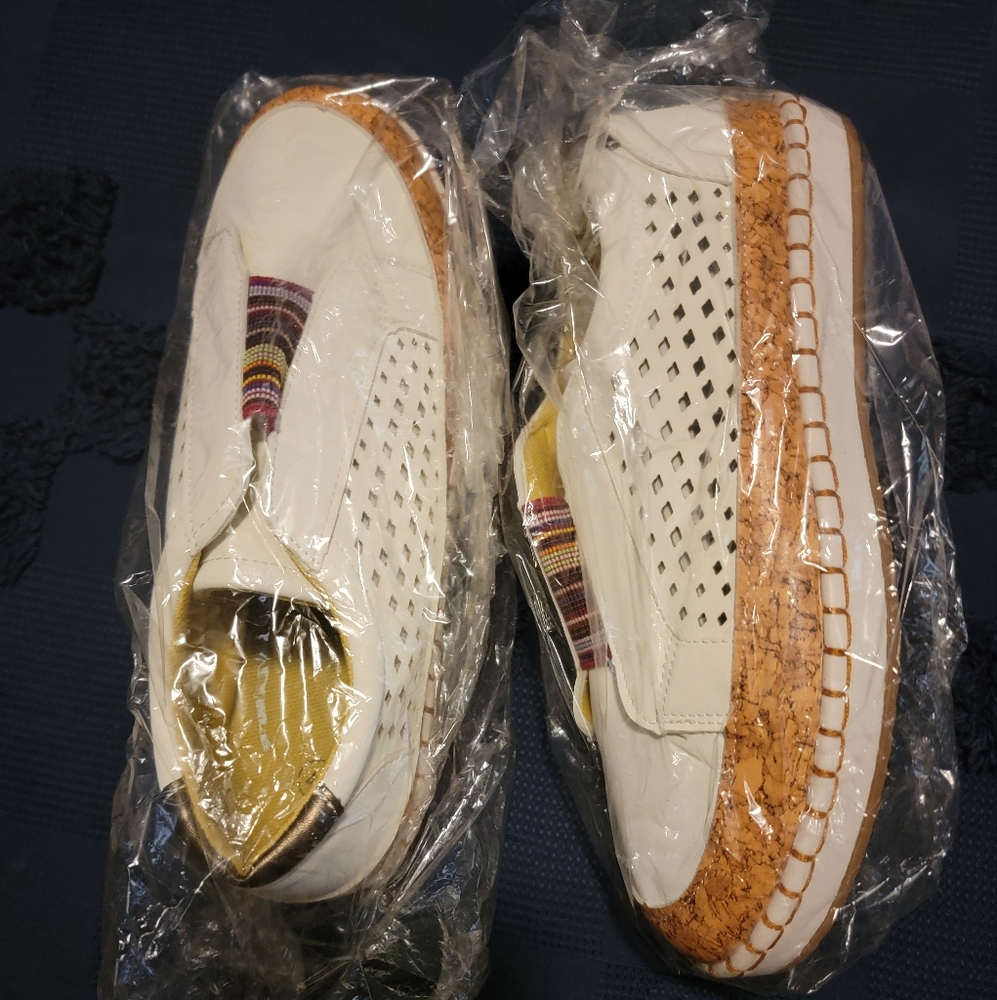 Stylish White Slip-On Sneakers with Colorful Accents